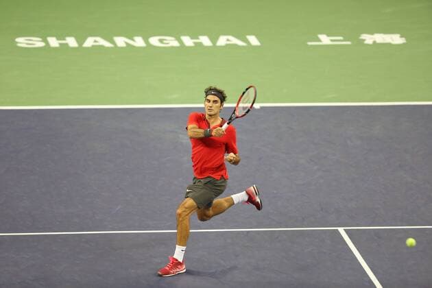 Roger Federer of Switzerland returns a shot in the third round of the men s singles during the 2014 Shanghai Rolex Masters tennis tournament in Shanghai, China, 9 October 2014. Shanghai Rolex Masters  20141009_66377