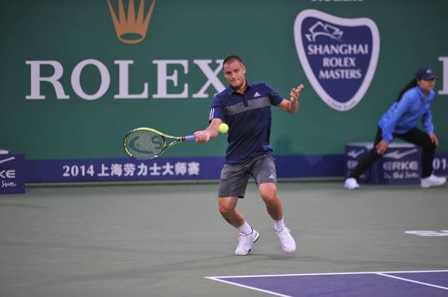 Mikhail Youzhny of Russia returns a shot in the third round of the men s singles during the 2014 Shanghai Rolex Masters tennis tournament in Shanghai, China, 9 October 2014. Shanghai Rolex Masters  20141009_45900