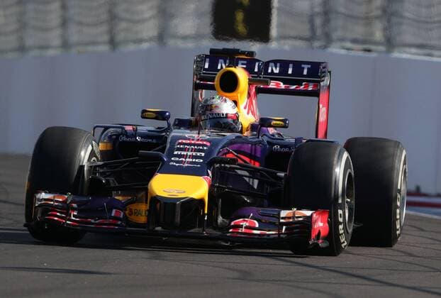 SOCHI, RUSSIA. OCTOBER 10, 2014. German racing driver Sebastian Vettel of the Infiniti Red Bull Racing team participates in the second free practice session of the 2014 Formula One Russian Grand Prix at the Sochi Autodrom racing circuit. StanislavKrasilnikov TASS  RE151827