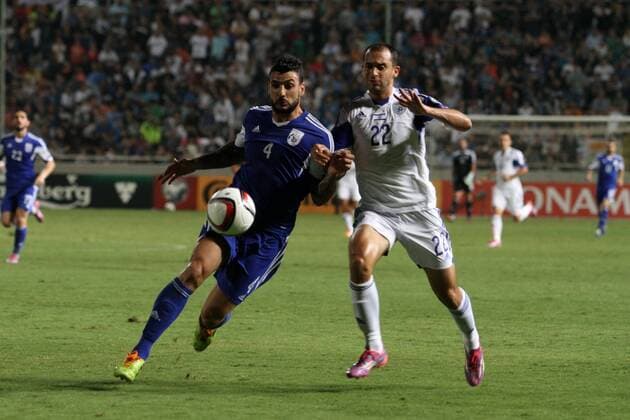 Israel s Omer Damari , fights for the ball with Giorgios Merkis of Cyprus during the Euro 2016 qualifying soccer match between Israel and Cyprus at Gsp Stadium in Nicosia, Cyprus, on Tuesday, Oct. 10, 2014