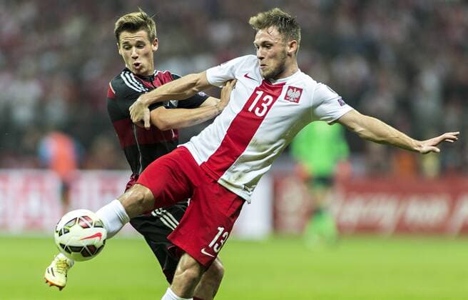 Erik Durm (GER), Maciej Rybus (POL) 11.10.2014, Warschau, Polen vs. Deutschland Â