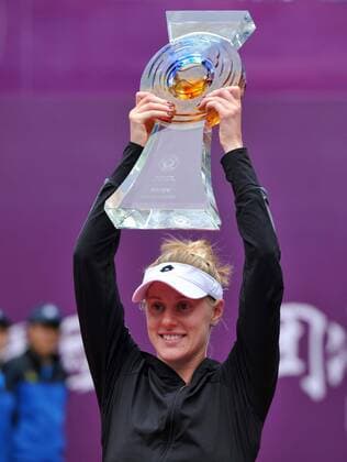Alison Riske of the United States holds the trophy during the awarding ceremony at the 2014 Tianjin Open tennis tournament in Tianjin, north China, on Oct. 12, 2014. (SP)CHINA-TIANJIN-TENNIS-WTA-OPEN YuexYuewei 