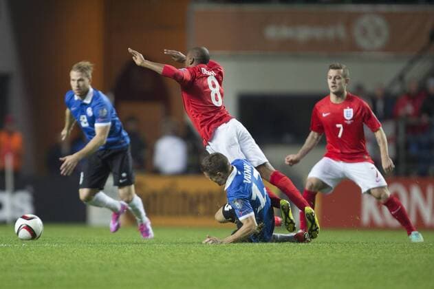 Martin Vunk of Estonia tackles Fabian Delph of England - Estonia vs. England - UEFA Euro 2016 Qualifier - A. Le Coq Arena - Tallinn - 12 10 2014 Pic Philip Oldham Sportimage EDITORIAL USE ONLY. No use with unauthorised audio, video, data, fixture lists, club league logos or live services. Online in-match use limited to 120 images, no video emulation. No use in betting, games or single club league player publications.