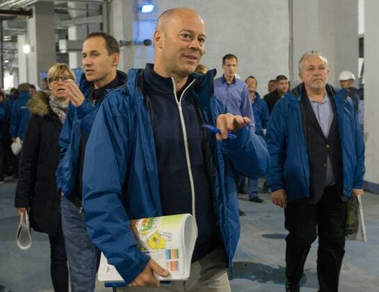 MOSCOW, RUSSIA. OCTOBER 18, 2014. FIFA inspection committee head Christian Unger (foreground) and FIFA and Russia 2018 officials in discussion at Fisht stadium which will become an arena for the coming 2018 FIFA World Cup. Artur Lebedev TASS  RE1522D5
