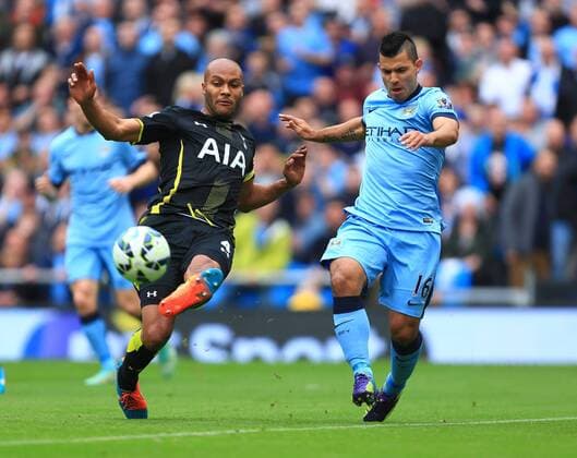 Tottenham s Younes Kaboul clears the ball after Sergio Kun Aguero of Manchester City is put through on goal - Manchester City vs. Tottenham Hotspurs - Barclay s Premier League - Etihad Stadium - Manchester - 18 10 2014 EDITORIAL USE ONLY. No use with unauthorised audio, video, data, fixture lists, club league logos or live services. Online in-match use limited to 120 images, no video emulation. No use in betting, games or single club league player publications.