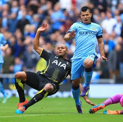 Tottenham s Younes Kaboul clears the ball after Sergio Kun Aguero of Manchester City is put through on goal - Manchester City vs. Tottenham Hotspurs - Barclay s Premier League - Etihad Stadium - Manchester - 18 10 2014 EDITORIAL USE ONLY. No use with unauthorised audio, video, data, fixture lists, club league logos or live services. Online in-match use limited to 120 images, no video emulation. No use in betting, games or single club league player publications.