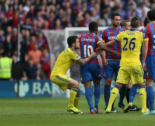 Chelsea s Cesc Fabregas throws Crystal Palace s Frazier Campbell to the ground - Barclays Premier League - Crystal Palace vs FC Chelsea London - Selhurst Park - England - 18th October 2014 - EDITORIAL USE ONLY. No use with unauthorised audio, video, data, fixture lists, club league logos or live services. Online in-match use limited to 120 images, no video emulation. No use in betting, games or single club league player publications.