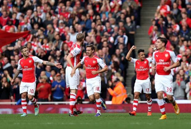 Players of Arsenal celebrate after scoring during the Barclays Premier League match between Arsenal and Hull City at Emirates Stadium on October 18, 2014 in London, England. The match ended in 2-2 draw. ) FOR EDITORIAL USE ONLY. NOT FOR SALE FOR MARKETING OR ADVERTISING CAMPAIGNS. NO USE WITH UNAUTHORIZED AUDIO, VIDEO, DATA, FIXTURE LISTS, CLUB LEAGUE LOGOS OR LIVE SERVICES. ONLINE IN-MATCH USE LIMITED TO 45 IMAGES, NO VIDEO EMULATION. NO USE IN BETTING, GAMES OR SINGLE CLUB LEAGUE PLAYER PUBLICATIONS. UK-LONDON-SOCCER-BARCLAYS PREMIER LEAGUE-ARSENAL VS HULL CITY HanxYan 