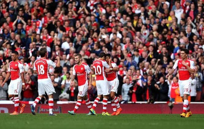 Players of Arsenal celebrate after scoring during the Barclays Premier League match between Arsenal and Hull City at Emirates Stadium on October 18, 2014 in London, England. The match ended in 2-2 draw. ) FOR EDITORIAL USE ONLY. NOT FOR SALE FOR MARKETING OR ADVERTISING CAMPAIGNS. NO USE WITH UNAUTHORIZED AUDIO, VIDEO, DATA, FIXTURE LISTS, CLUB LEAGUE LOGOS OR LIVE SERVICES. ONLINE IN-MATCH USE LIMITED TO 45 IMAGES, NO VIDEO EMULATION. NO USE IN BETTING, GAMES OR SINGLE CLUB LEAGUE PLAYER PUBLICATIONS. UK-LONDON-SOCCER-BARCLAYS PREMIER LEAGUE-ARSENAL VS HULL CITY HanxYan