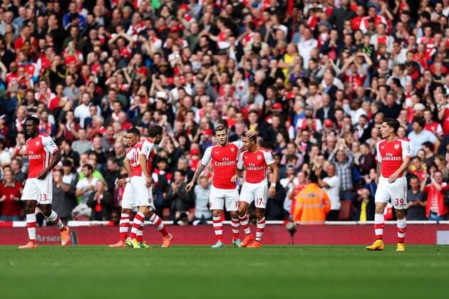 Players of Arsenal celebrate after scoring during the Barclays Premier League match between Arsenal and Hull City at Emirates Stadium on October 18, 2014 in London, England. The match ended in 2-2 draw. ) FOR EDITORIAL USE ONLY. NOT FOR SALE FOR MARKETING OR ADVERTISING CAMPAIGNS. NO USE WITH UNAUTHORIZED AUDIO, VIDEO, DATA, FIXTURE LISTS, CLUB LEAGUE LOGOS OR LIVE SERVICES. ONLINE IN-MATCH USE LIMITED TO 45 IMAGES, NO VIDEO EMULATION. NO USE IN BETTING, GAMES OR SINGLE CLUB LEAGUE PLAYER PUBLICATIONS. UK-LONDON-SOCCER-BARCLAYS PREMIER LEAGUE-ARSENAL VS HULL CITY HanxYan
