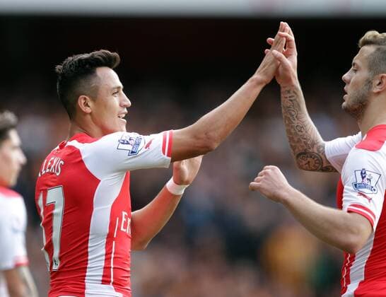 Arsenal v Hull City . . London, UK . . 18.10.2014 Alexis Sanchez (A) celebrates his goal with Jack Wilshere (A) 1-0