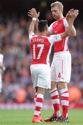 Arsenal v Hull City . . London, UK . . 18.10.2014 Alexis Sanchez (A) celebrates scoring a goal for Arsenal with Per Mertesacker (A) 1-0. 