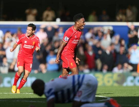 Liverpool s Raheem Sterling celebrates setting up the winning goal - Barclays Premier League - QPR vs Liverpool - Loftus Road - England - 19th October 2014 - Picture David Klein Sportimage EDITORIAL USE ONLY. No use with unauthorised audio, video, data, fixture lists, club league logos or live services. Online in-match use limited to 120 images, no video emulation. No use in betting, games or single club league player publications.