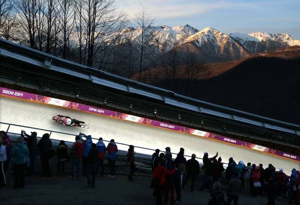 February 12, 2014 - Sochi, Russia - CHRISTIAN NICCUM and JAYSON TERDIMAN of the USA, cruises around a turn to an 11th place finish in Men s Luge Doubles, as the sun sets on the Caucasus Mountains at the Sanki Sliding Center at the 2014 Sochi Winter Olympics. Rocky Mountain High  - ZUMASoch