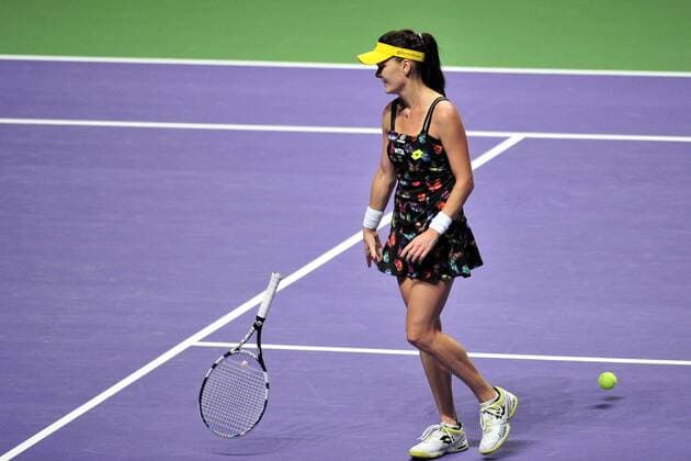 Poland s Agnieszka Radwanska throws her racket during the white group round robin match at the WTA Tennis Damen Finals at the Singapore Indoor Stadium, Oct. 24, 2014. ThenxChihxWey 