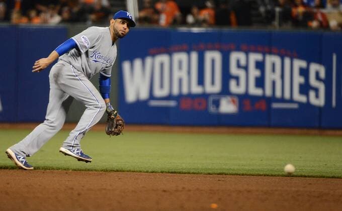 San Francisco Giants Brandon Crawford s ground ball passes Kansas City Royals second baseman Omar Infante for a single during the sixth inning in game 3 of the World Series at AT&T Park in San Francisco on October 24, 2014.  SXP2014102426