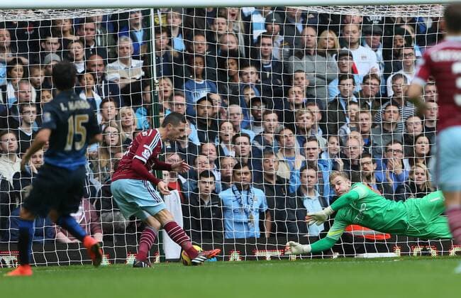 West Ham s Morgan Amalfintano scoring his sides opening goal Barclays Premier League - West Ham United vs Manchester City - Upton Park - England - 25th October 2014 - Picture David Klein Sportimage EDITORIAL USE ONLY. No use with unauthorised audio, video, data, fixture lists, club league logos or live services. Online in-match use limited to 120 images, no video emulation. No use in betting, games or single club league player publications.