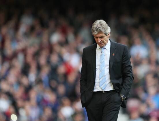 Manchester City s Manuel Pellegrini looks on dejected Barclays Premier League - West Ham United vs Manchester City - Upton Park - England - 25th October 2014 - Picture David Klein Sportimage EDITORIAL USE ONLY. No use with unauthorised audio, video, data, fixture lists, club league logos or live services. Online in-match use limited to 120 images, no video emulation. No use in betting, games or single club league player publications.