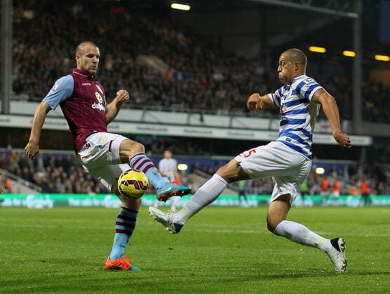 QPR s Bobby Zamora tussles with Aston Villa s Ron Vlaar Barclays Premier League - Queens Park Rangers Vs Aston Villa - Loftus Road - England - 27th October 2014 - Picture David Klein Sportimage EDITORIAL USE ONLY. No use with unauthorised audio, video, data, fixture lists, club league logos or live services. Online in-match use limited to 120 images, no video emulation. No use in betting, games or single club league player publications.