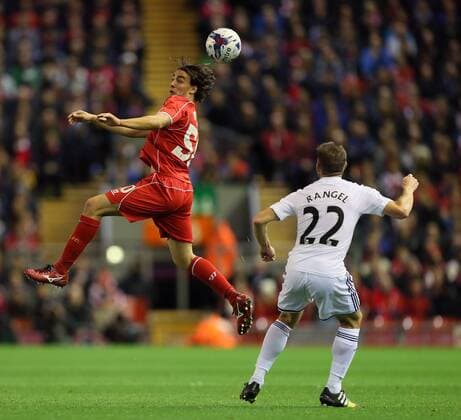 Liverpool s Lazer Markovic tussles with Swansea s Angel Rangel League Cup Fourth Round- Liverpool vs Swansea City - Anfield - England - 28th October 2014 - Picture David Klein Sportimage EDITORIAL USE ONLY. No use with unauthorised audio, video, data, fixture lists, club league logos or live services. Online in-match use limited to 120 images, no video emulation. No use in betting, games or single club league player publications.