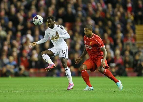 Liverpool s Glen Johnson tussles with Swansea s Nathan Dyer League Cup Fourth Round- Liverpool vs Swansea City - Anfield - England - 28th October 2014 - Picture David Klein Sportimage EDITORIAL USE ONLY. No use with unauthorised audio, video, data, fixture lists, club league logos or live services. Online in-match use limited to 120 images, no video emulation. No use in betting, games or single club league player publications.