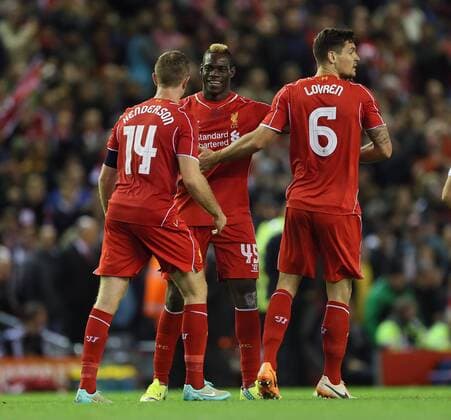 Liverpool s Mario Balotelli celebrates with goalscorer Dejan Lovren League Cup Fourth Round- Liverpool vs Swansea City - Anfield - England - 28th October 2014 - Picture David Klein Sportimage EDITORIAL USE ONLY. No use with unauthorised audio, video, data, fixture lists, club league logos or live services. Online in-match use limited to 120 images, no video emulation. No use in betting, games or single club league player publications.