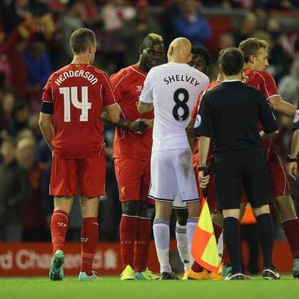 Liverpool s Mario Balotelli argues with Swansea s Jonjo Shelvey at the final whistle League Cup Fourth Round- Liverpool vs Swansea City - Anfield - England - 28th October 2014 - Picture David Klein Sportimage EDITORIAL USE ONLY. No use with unauthorised audio, video, data, fixture lists, club league logos or live services. Online in-match use limited to 120 images, no video emulation. No use in betting, games or single club league player publications.