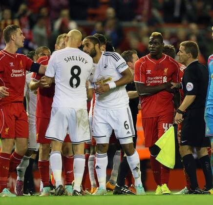 Liverpool s Mario Balotelli argues with Swansea s Jonjo Shelvey at the final whistle League Cup Fourth Round- Liverpool vs Swansea City - Anfield - England - 28th October 2014 - Picture David Klein Sportimage EDITORIAL USE ONLY. No use with unauthorised audio, video, data, fixture lists, club league logos or live services. Online in-match use limited to 120 images, no video emulation. No use in betting, games or single club league player publications.