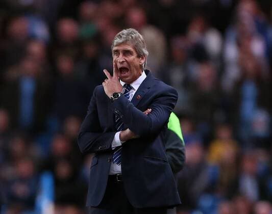 Manchester City s Manuel Pellegrini looks on dejected League Cup Fourth Round- Manchester City vs Newcastle United - Etihad Stadium - England - 29th October 2014 - EDITORIAL USE ONLY. No use with unauthorised audio, video, data, fixture lists, club league logos or live services. Online in-match use limited to 120 images, no video emulation. No use in betting, games or single club league player publications.