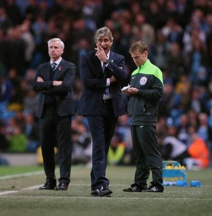 Manchester City s Manuel Pellegrini looks on dejected League Cup Fourth Round- Manchester City vs Newcastle United - Etihad Stadium - England - 29th October 2014 - EDITORIAL USE ONLY. No use with unauthorised audio, video, data, fixture lists, club league logos or live services. Online in-match use limited to 120 images, no video emulation. No use in betting, games or single club league player publications.