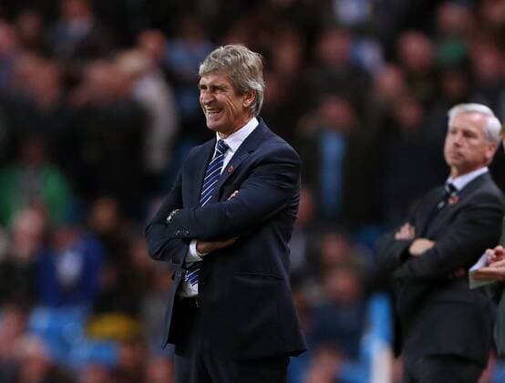 Manchester City s Manuel Pellegrini looks on dejected League Cup Fourth Round- Manchester City vs Newcastle United - Etihad Stadium - England - 29th October 2014 - EDITORIAL USE ONLY. No use with unauthorised audio, video, data, fixture lists, club league logos or live services. Online in-match use limited to 120 images, no video emulation. No use in betting, games or single club league player publications.