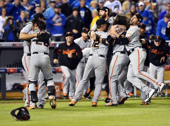 The San Francisco Giants celebrate after defeating the Kansas City Royals in game 7 of the World Series at Kauffman Stadium in Kansas City, Missouri on October 29, 2014. The Giants defeated the Royals 3-2 to win the World Series.  KCP20141029207
