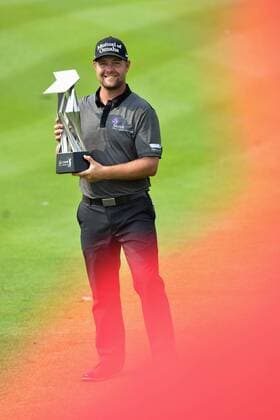 (141102) -- KUALA LUMPUR, Nov. 2, 2014 -- Ryan Moore of the US poses with his trophy after winning the 2014 CIMB Classic golf tournament in Kuala Lumpur on November 2, 2014. ) (SP)MALAYSIA-KUALA LUMPUR-GOLF ChongxVoonxChung 