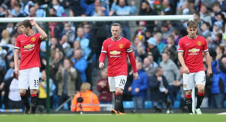 Paddy McNair, Wayne Rooney and Luke Shaw of Manchester United walk back dejected following the City opening goal - Barclays Premier League - Manchester City vs Manchester Utd - Etihad Stadium - Manchester - England - 2nd November 2014 - Picture David Klein Sportimage EDITORIAL USE ONLY. No use with unauthorised audio, video, data, fixture lists, club league logos or live services. Online in-match use limited to 120 images, no video emulation. No use in betting, games or single club league player publications.
