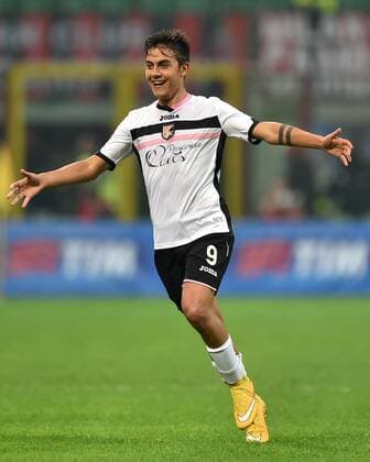 (141103) -- MILAN, Nov. 2, 2014 -- Paulo Dybala of Palermo celebrates for his goal during the Serie A football match against AC Milan in Milan, Italy, on Nov. 2, 2014. AC Milan lost 0-2. ) (SP)ITALY-MILAN-SERIE A-AC MILAN VS. PALERMO AlbertoxLingria 