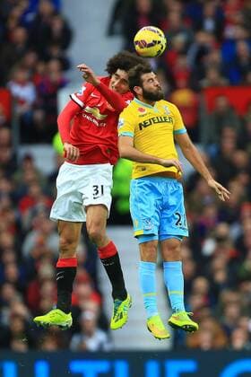 Marouane Fellaini of Manchester United and Joe Ledley of Crystal Palace contest a header - Manchester United vs. Crystal Palace - Barclay s Premier League - Old Trafford - Manchester - 08 11 2014 Pic Philip Oldham Sportimage EDITORIAL USE ONLY. No use with unauthorised audio, video, data, fixture lists, club league logos or live services. Online in-match use limited to 120 images, no video emulation. No use in betting, games or single club league player publications.