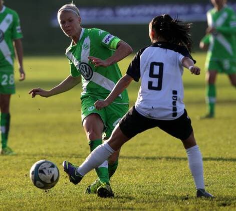 SOCCER - CL, Neulengbach vs Wolfsburg NEULENGBACH,AUSTRIA,09.NOV.14 - SOCCER - UEFA Champions League, Women, NOESV Neulengbach vs VfL Wolfsburg. Image shows Nina Fischer (Wolfsburg) and Claudia Wasser (Neulengbach). 