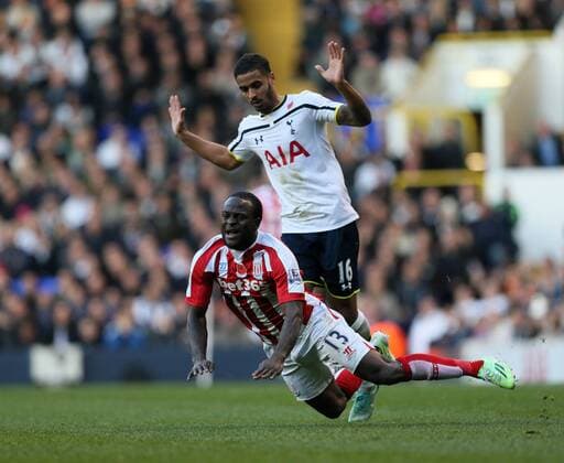 Tottenham s Kyle Naughton gets sent off for this tackle on Stoke s Victor Moses - Barclays Premier League - Tottenham Hotspur vs Stoke City- White Hart Lane - London - England - 9th November 2014 - Picture David Klein Sportimage EDITORIAL USE ONLY. No use with unauthorised audio, video, data, fixture lists, club league logos or live services. Online in-match use limited to 120 images, no video emulation. No use in betting, games or single club league player publications.