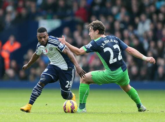 Stephane Sessegnon of West Bromwich Albion turns Daryl Janmaat of Newcastle United - Barclays Premier League - WBA vs Newcastle Utd - Hawthorns Stadium - West Bromwich - England - 9th November 2014 - Picture Simon Bellis Sportimage EDITORIAL USE ONLY. No use with unauthorised audio, video, data, fixture lists, club league logos or live services. Online in-match use limited to 120 images, no video emulation. No use in betting, games or single club league player publications.