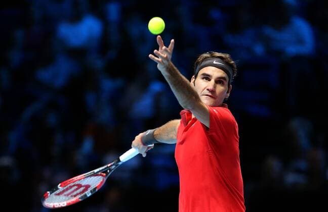 Roger Federer of Switzerland serves during the ATP Tennis Herren World Tour Finals Group B match in London, Britain, on Nov. 9, 2014. (SP)BRITAIN-LONDON-TENNIS-ATP WORLD TOUR FINALS-FEDERER VS RAONIC HanxYan 
