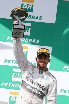 Mercedes driver Lewis Hamilton holds his trophy at the awarding ceremony after the Brazilian Formula One Grand Prix in Sao Paulo, Brazil, on Nov. 9, 2014. (SP)BRAZIL-SAO PAULO-F1-GRAND PRIX XuxZijian 