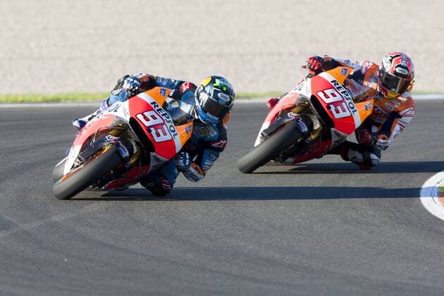 Valencia, SPAIN - Test as riders and teams start their preparation for the 2015 MotoGP World Championship. Circuit Ricardo Tormo. In the picture: The Marquez brothers Alex and Marc in Valencia test. 