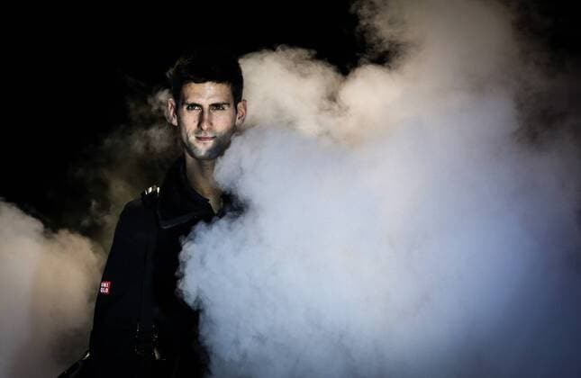 LONDON, Nov. 12, 2014 -- Novak Djokovic of Serbia walks into the court before the ATP Tennis Herren World Tour Finals Group match in London, Britain, on Nov. 12, 2014. TangxShi 