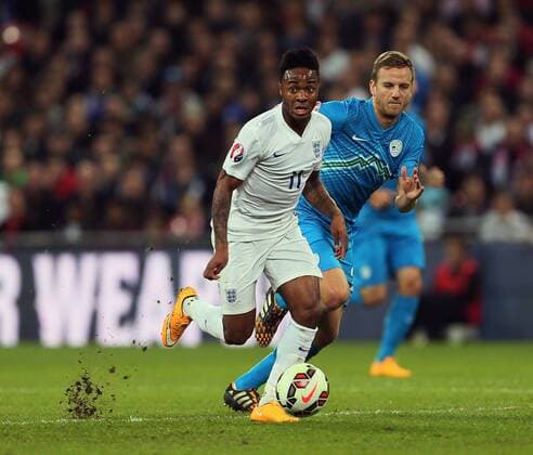 England s Raheem Sterling runs away as the pitch cuts up behind him - International European Qualifier - England vs Slovenia- Wembley Stadium - London - England - 15th November 2014 - Picture David Klein Sportimage EDITORIAL USE ONLY. No use with unauthorised audio, video, data, fixture lists, club league logos or live services. Online in-match use limited to 120 images, no video emulation. No use in betting, games or single club league player publications.
