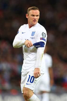 Wayne Rooney of England tugs at his captain s armband - England vs. Slovenia - UEFA Euro 2016 Qualifying - Wembley Stadium - London - 15 11 2014 Pic Philip Oldham Sportimage EDITORIAL USE ONLY. No use with unauthorised audio, video, data, fixture lists, club league logos or live services. Online in-match use limited to 120 images, no video emulation. No use in betting, games or single club league player publications.
