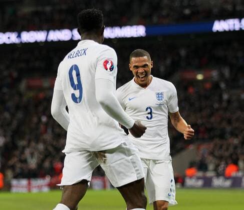 England s Kieran Gibbs celebrates with goalscorer Danny Welbeck - International European Qualifier - England vs Slovenia- Wembley Stadium - London - England - 15th November 2014 - Picture David Klein Sportimage EDITORIAL USE ONLY. No use with unauthorised audio, video, data, fixture lists, club league logos or live services. Online in-match use limited to 120 images, no video emulation. No use in betting, games or single club league player publications.