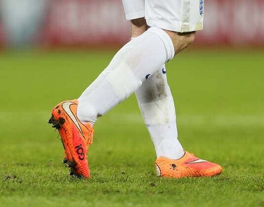 England s Wayne Rooney wears boots to commemorate his 100th cap - International European Qualifier - England - - Wembley Stadium - London - England - 15th November 2014 - Picture DavidxKlein Sportimage EDITORIAL USE ONLY. No use with unauthorised audio, video, data, fixture lists, club league logos or live services. Online in-match use limited to 120 images, no video emulation. No use in betting, games or single club league player publications.