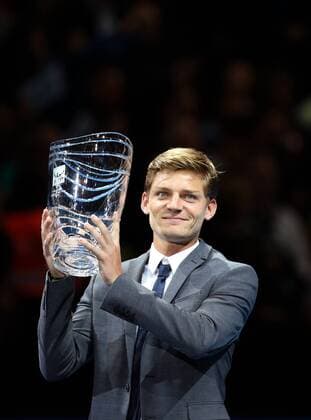 David Goffin of Belgium poses with his trophy of the ATP Tennis Herren Comeback Player of the Year award on day seven of the Barclays ATP Tennis Herren World Tour Finals in London, Great Britain on Nov. 15, 2014. (SP)UK-LONDON-TENNIS-ATP WORLD TOUR FINALS HanxYan 