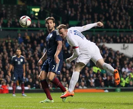 England s Wayne Rooney scoring his sides second goal - International Friendly - Scotland vs England- Celtic Park - Glasgow - Scotland - 18th November 2014 - Picture David Klein Sportimage EDITORIAL USE ONLY. No use with unauthorised audio, video, data, fixture lists, club league logos or live services. Online in-match use limited to 120 images, no video emulation. No use in betting, games or single club league player publications.