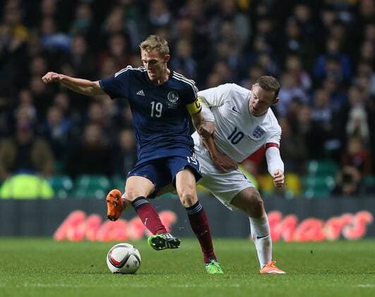 Scotland s Darren Fletcher tussles with England s Wayne Rooney - International Friendly - Scotland vs England- Celtic Park - Glasgow - Scotland - 18th November 2014 - Picture David Klein Sportimage EDITORIAL USE ONLY. No use with unauthorised audio, video, data, fixture lists, club league logos or live services. Online in-match use limited to 120 images, no video emulation. No use in betting, games or single club league player publications.